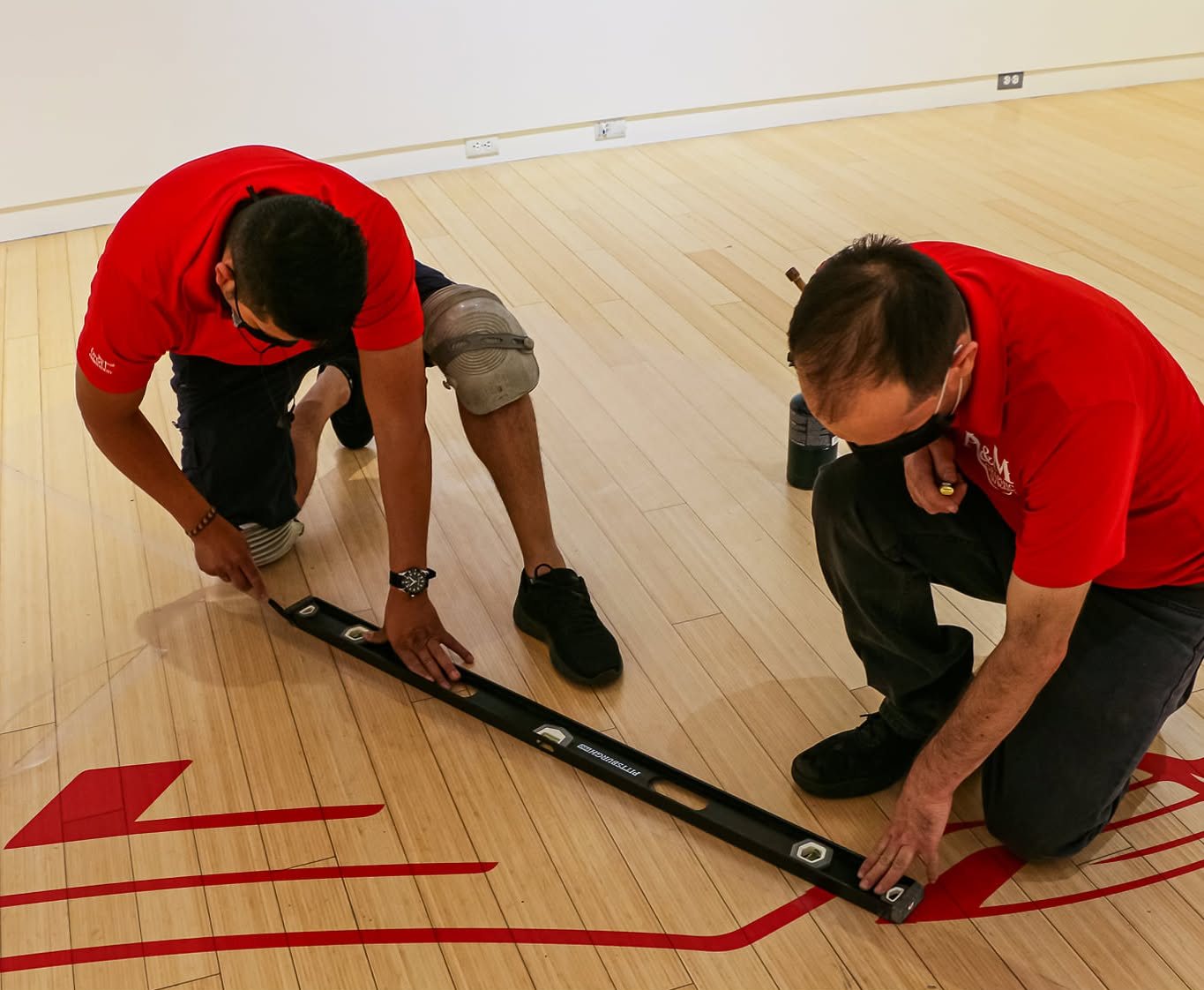 A&M Graphics installation team applying a large-format floor graphic